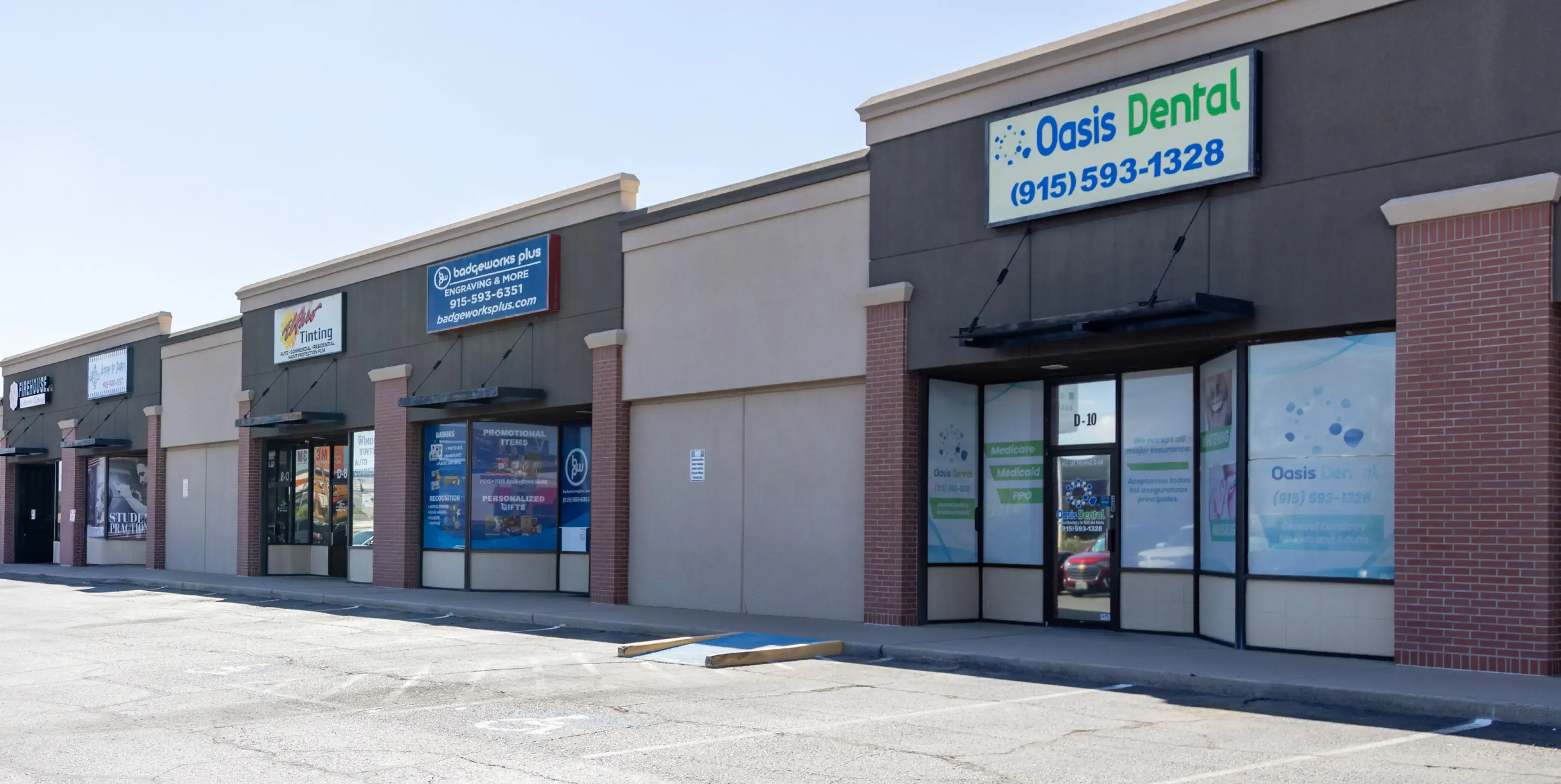 A store front with a car parked in front of it.